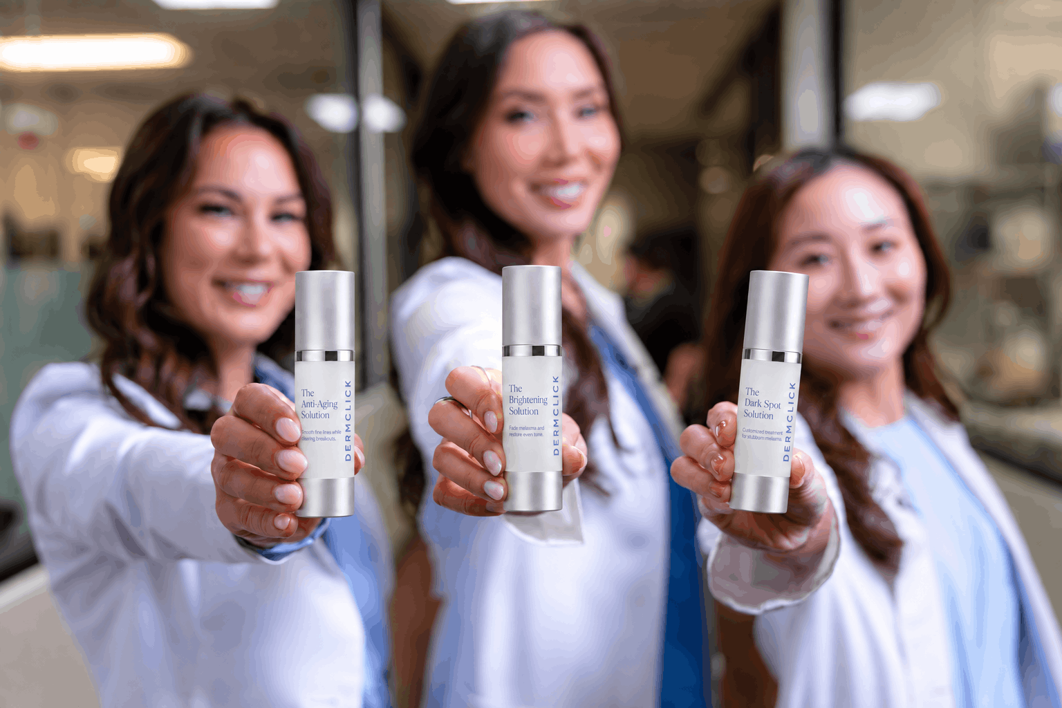DermClick's three founding dermatologists each holding one of the three tretinoin formulas