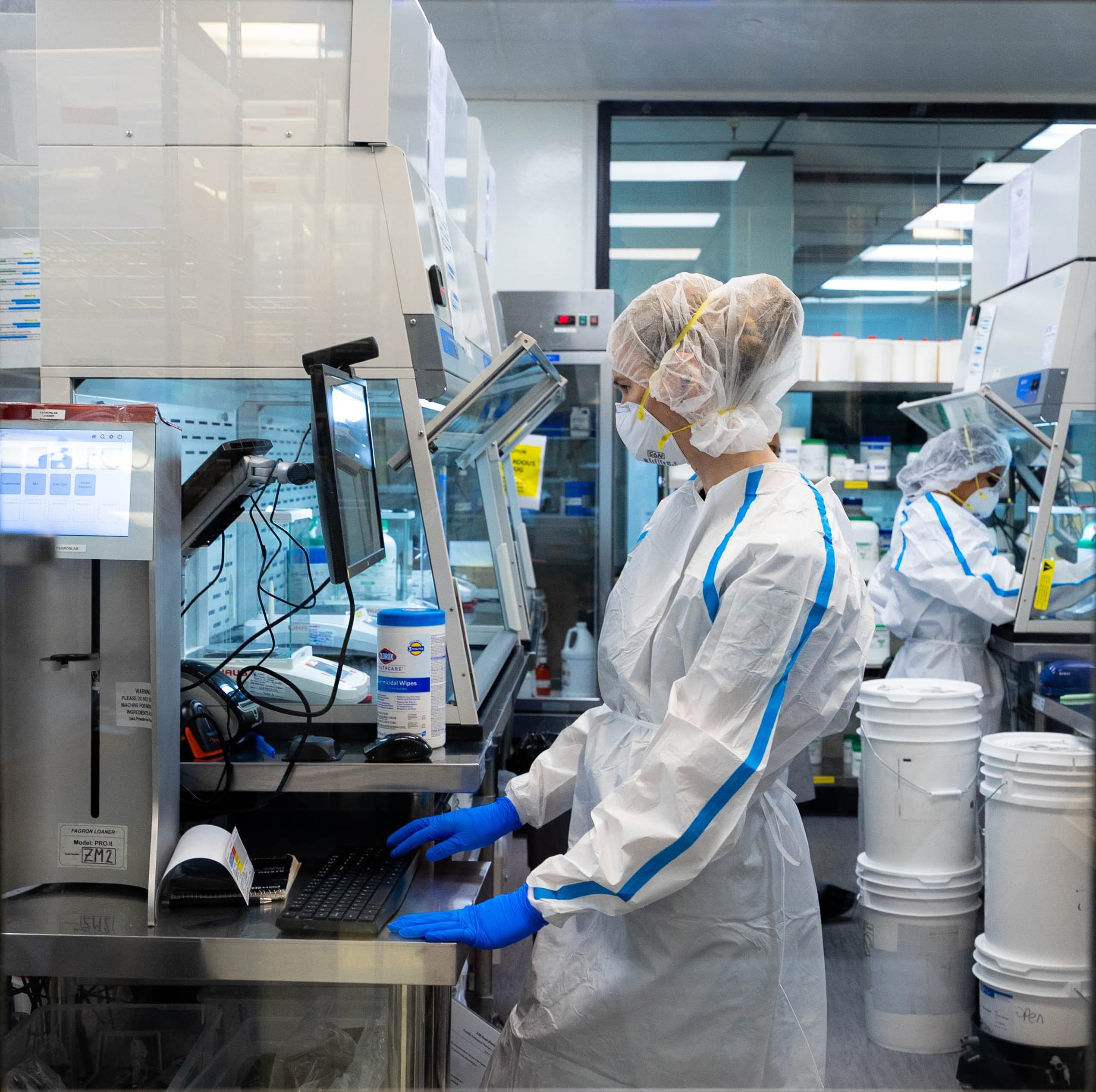 A DermClick pharmacist compounding a tretinoin formula in the clean room