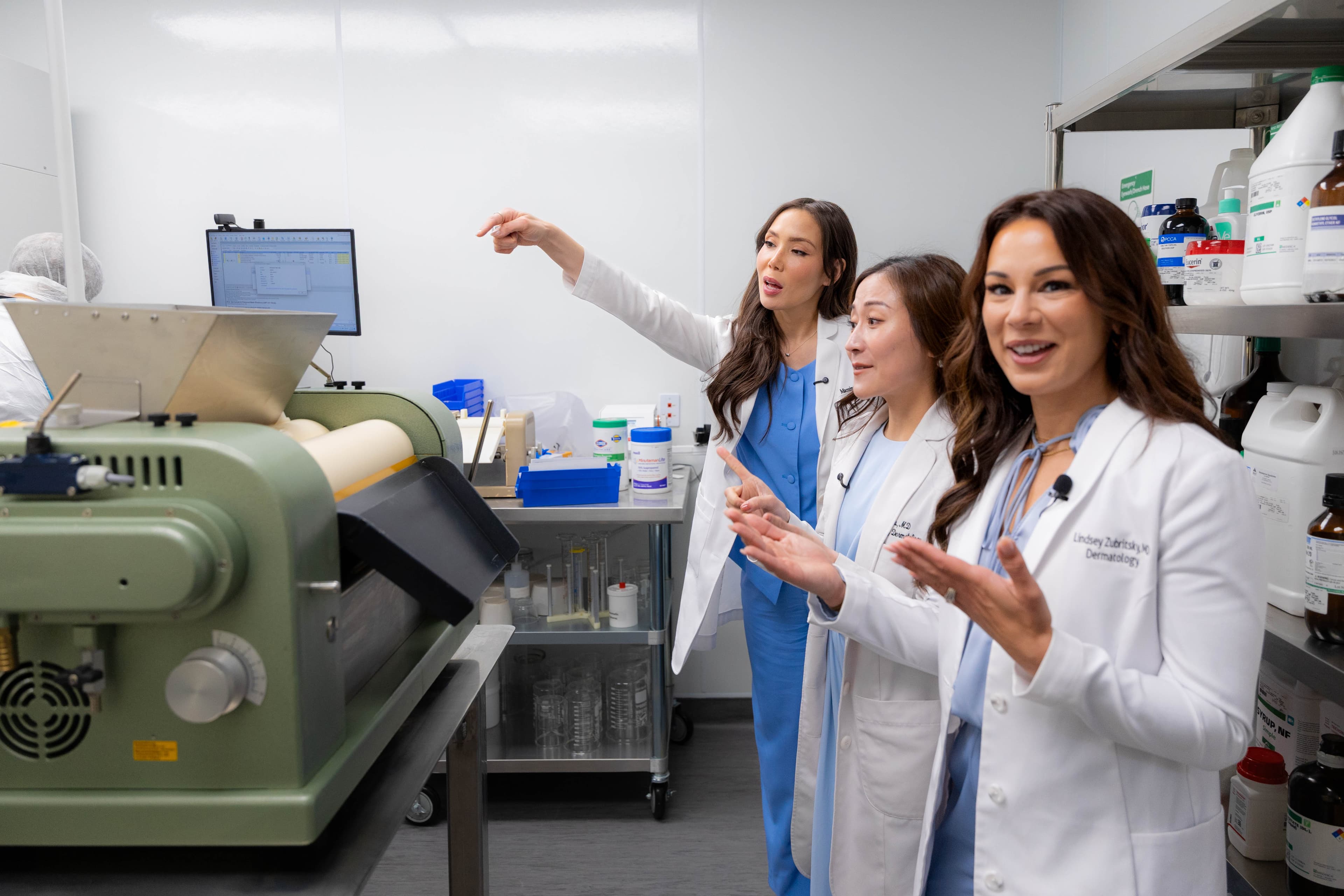 DermClick's founding dermatologists reviewing a formula in the compounding lab